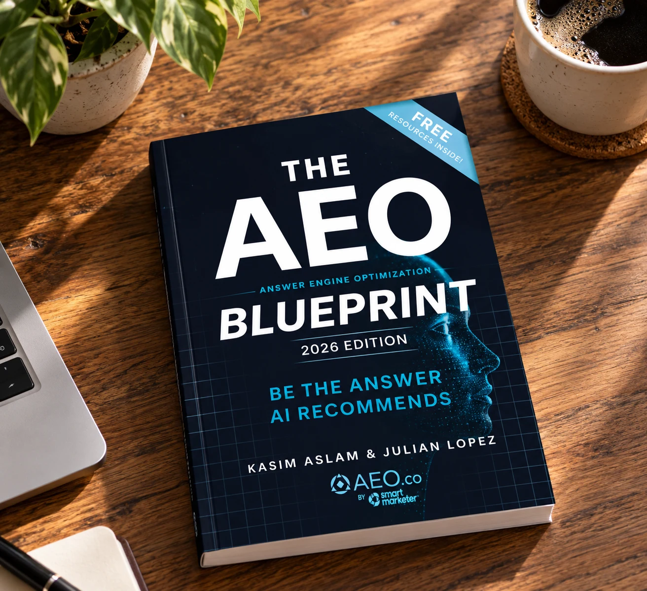 The AEO Blueprint, 2026 edition, on a wooden desk beside a laptop and coffee